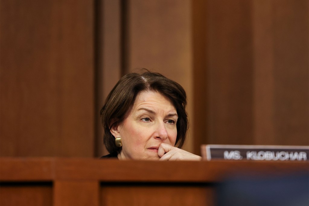 Amy Klobuchar listens during a Senate Judiciary Committee hearing on voting rights on Capitol Hill.