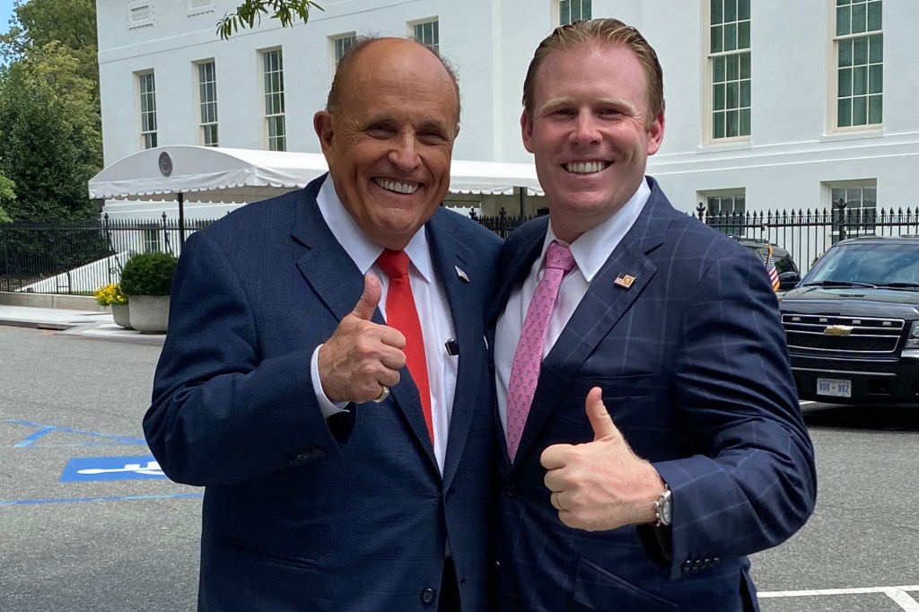 Former Mayor Rudy Giuliani poses with his son, Andrew Giuliani.