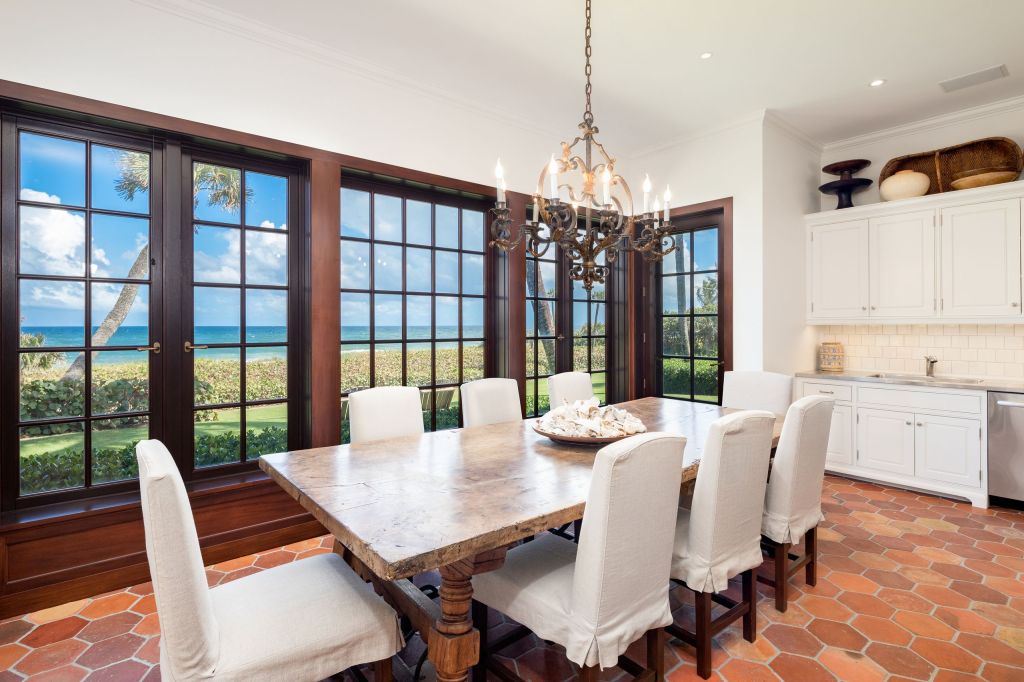 The formal dining room with oversized windows. 