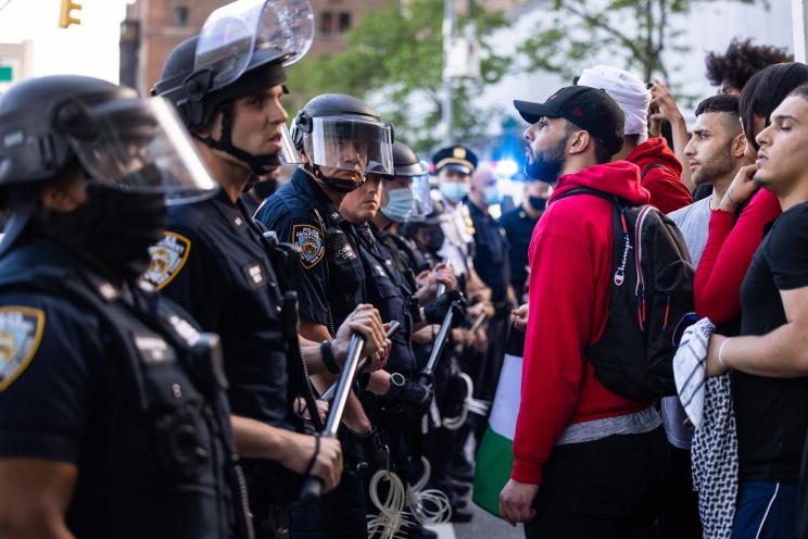 Pro-Palestine demonstrators confront officers during a protest in Midtown Manhattan on May 18, 2021.