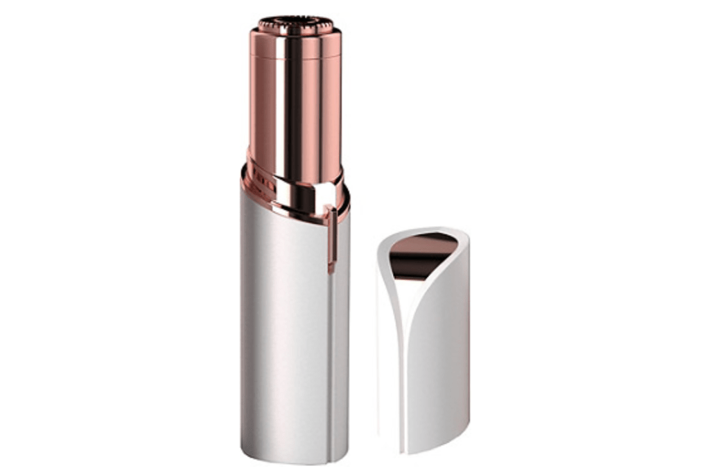 A white and rose gold electric facial shaver 