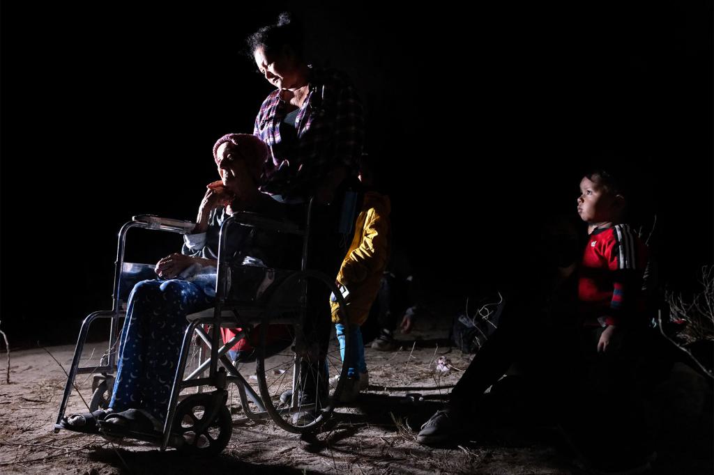 An Honduran family waits to be processed by border patrol agents in Roma, Texas, on April 29, 2021.