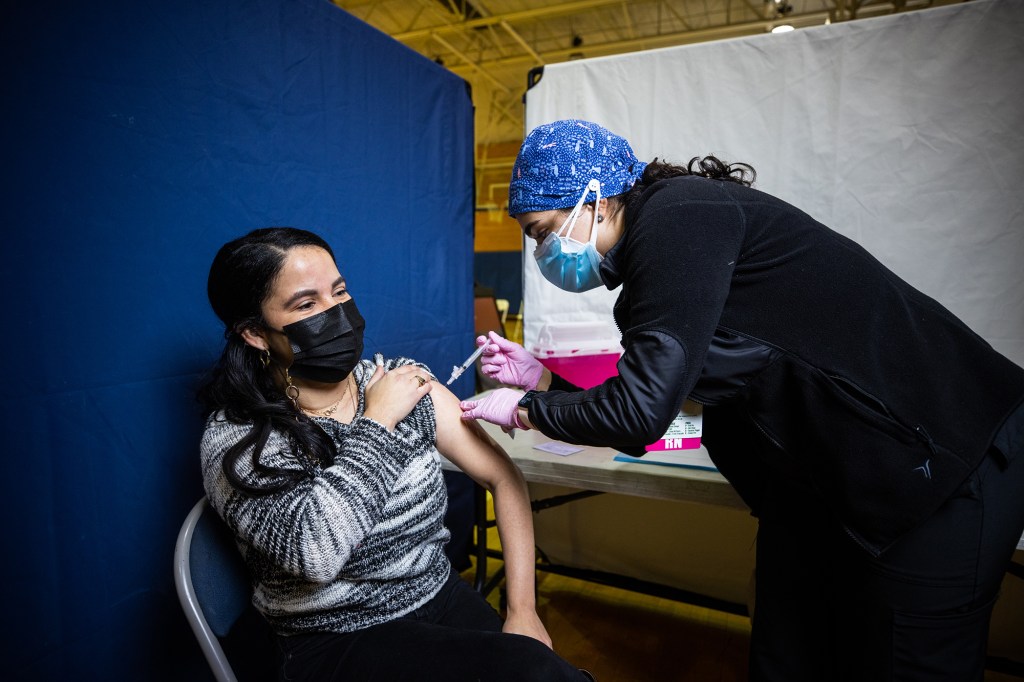 A woman receives her second shot in NYC.