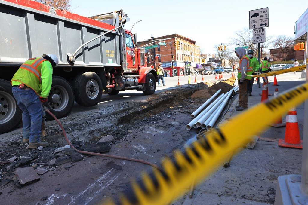 Construction worker make infrastructure repairs on the intersection of Church Avenue and Coney Island Avenue in the Flatbush neighborhood of Brooklyn on April 6, 2021.