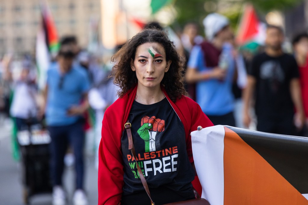 Pro-Palestine protesters march in midtown to protest the conflict between Israel and Palestine. 