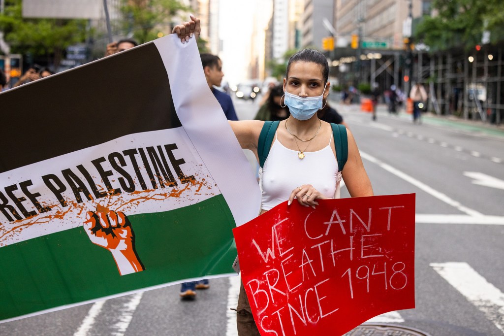 Pro-Palestine protesters march in midtown to protest the conflict between Israel and Palestine.