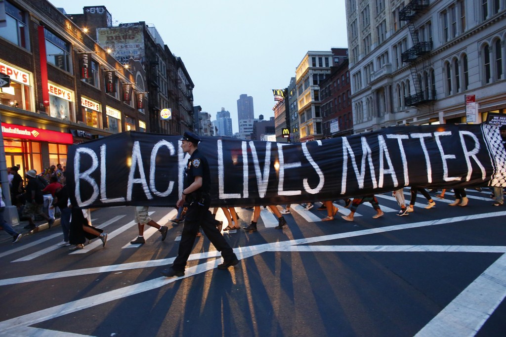 A police officer patrols during a protest in support of the Black Lives Matter movement.