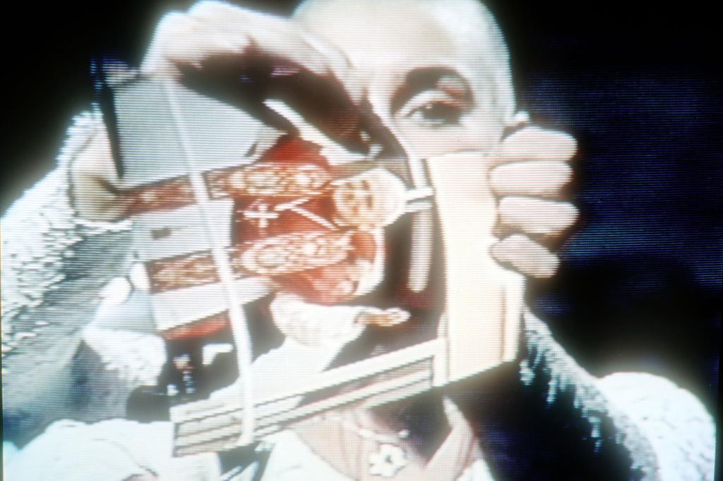 Sinead O'Connor ripped a photo of the Pope during her stint as host.