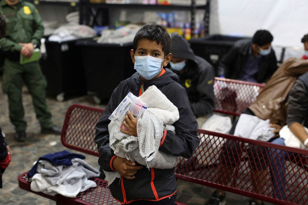 A migrant child waiting to take a shower at the DHS holding facility in Donna, Texas on March 30, 2021.