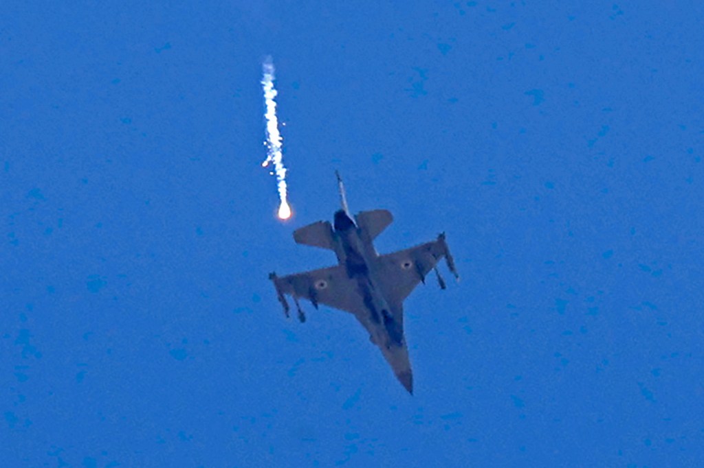 An Israeli F-16 fighter jet releases flare near Sderot, in southern Israel on the border with the Hamas-controlled Gaza Strip, on May 14, 2021.