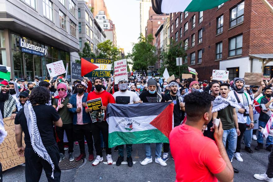 Pro-Palestine protesters march in midtown to protest the conflict between Israel and Palestine.