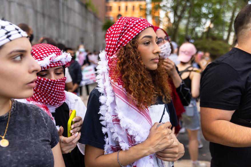 Pro Palestine protesters march in midtown to protest the conflict between Israel and Palestine.