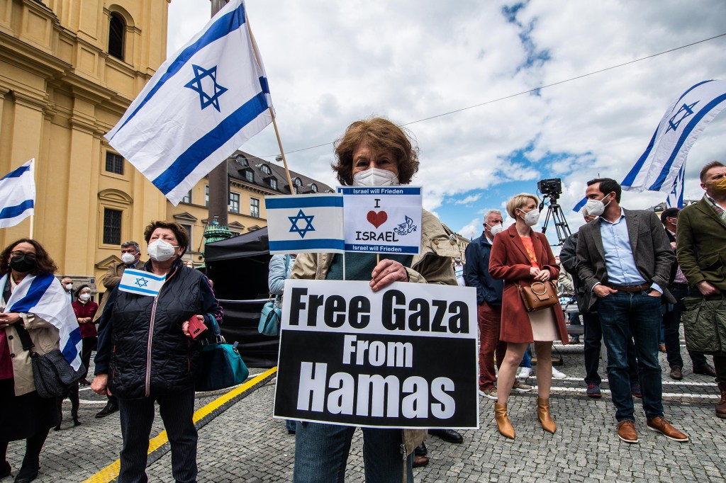 Protesters hold 'Free Gaza from Hamas'' signs at a demonstration against anti-semitism in Munich, Germany on May 14, 2021.