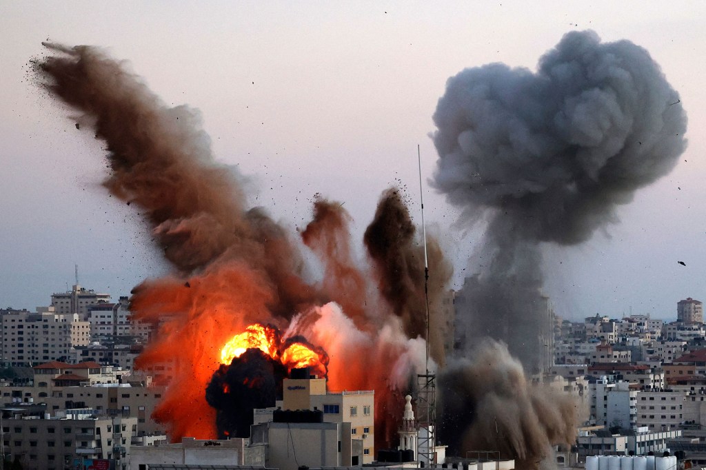 Smoke billows after an Israeli airstrike on Gaza City targeted the Ansar compound, linked to the Hamas movement, in the Gaza Strip on May 14, 2021.