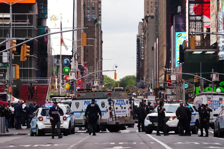 New York Police Department patrol the scene of a triple shooting in Times Square on Saturday, May 8, 2021.