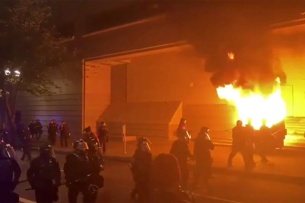 A dumpster was set on fire amid the protests in Portland.