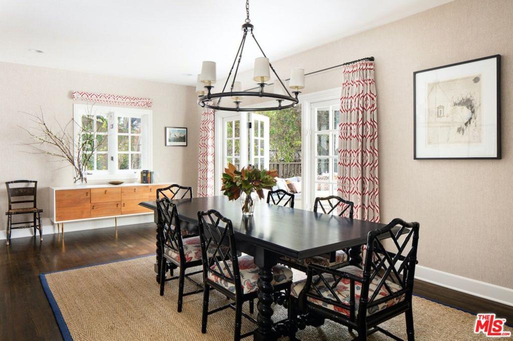 The dining room has a built-in bar and a french doors leading outside to a comfortable terrace.