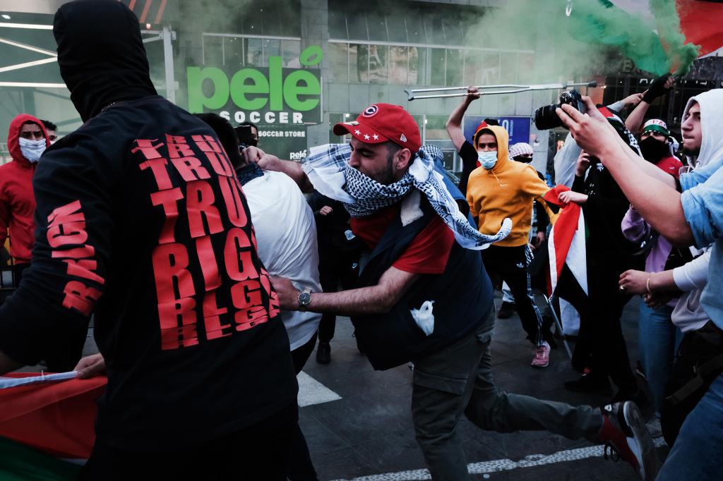 Pro-Palestinian protesters face off with a group of Israel supporters and police in a violent clash in Times Square on May 20, 2021.