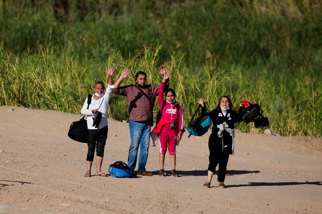 Migrants from Colombia surrender to authorities in Yuma, Arizona on May 13, 2021.