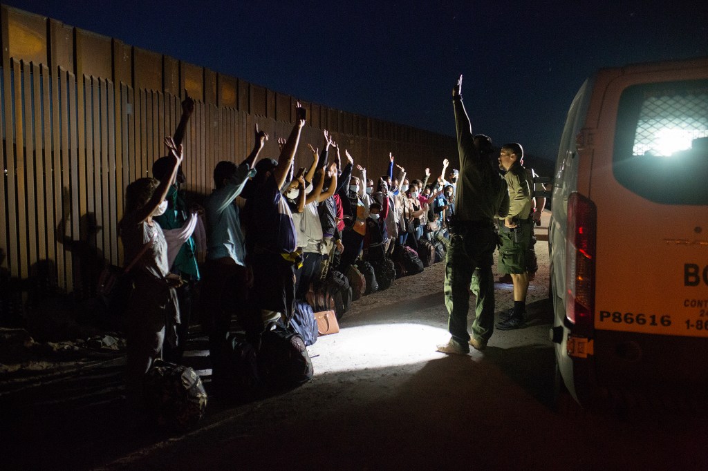 Border patrol agents detain asylum seekers from Central America near Yuma, Arizona on April 29, 2021.