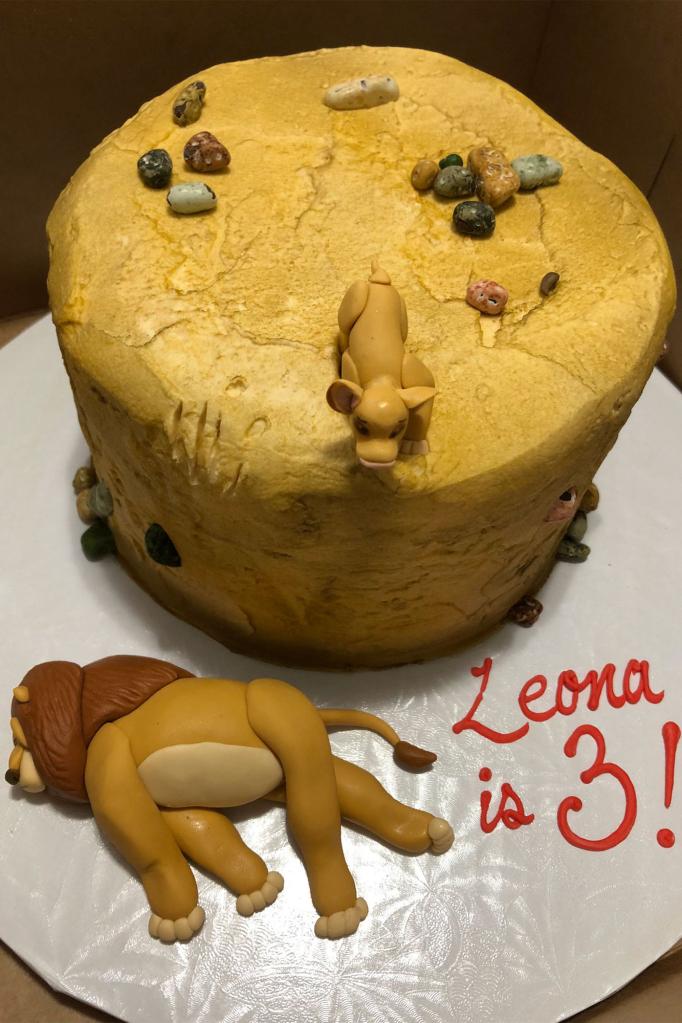 The birthday cake reenacts the tragic "Lion King" scene where Mufasa falls to his death.