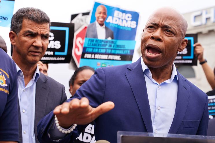 New York City mayoral candidate Eric Adams speaks speaks during a news conference across the street from a New York City Sanitation Department(DSNY) Sanitation Enforcement Brooklyn Zone on Monday, June 14, 2021 in Queens, N.Y. Adams was joined by sanitation workers who allege pay inequality under mayoral candidate and former NYC Sanitation Commissioner Kathryn Garcia.