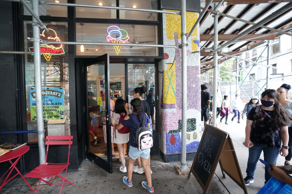 Customer's wait on a line to enter this afternoon,  at Ben and Jerry's ice cream shop, located on Broadway at W 104st., mhtn.