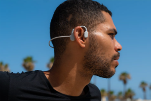 A man wearing an over-ear headphone