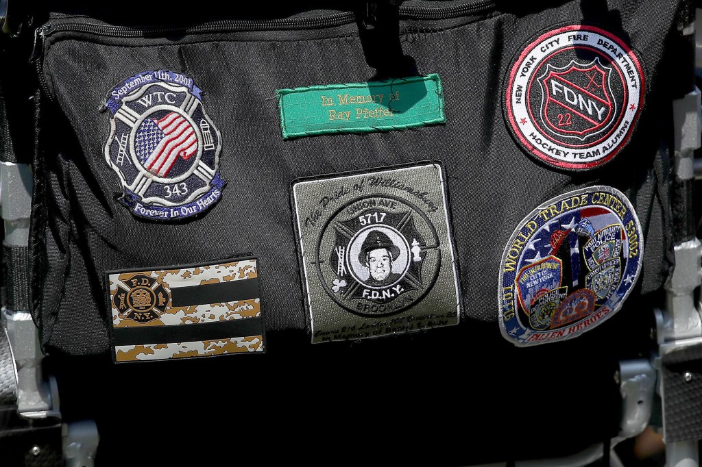 A detail of patches on a bag as first responders and their families listen as U.S. President Donald Trump speaks during a signing ceremony for H.R. 1327, an act to permanently authorize the September 11th victim compensation fund, in the Rose Garden of the White House July 29, 2019 in Washington, DC