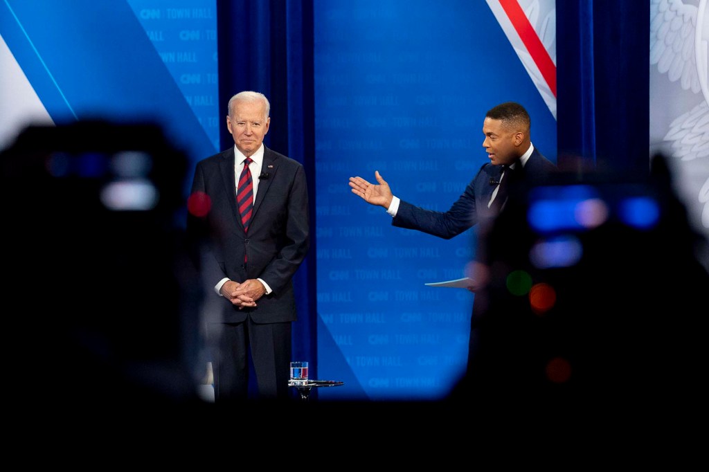 Cameras are visible in the foreground as President Joe Biden accompanied by CNN journalist Don Lemon, right, appears at a CNN town hall at Mount St. Joseph University in Cincinnati.