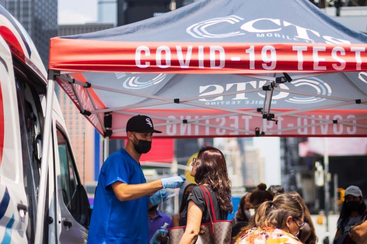 A woman getting tested for COVID-19 in Times Square on July 27, 2021.