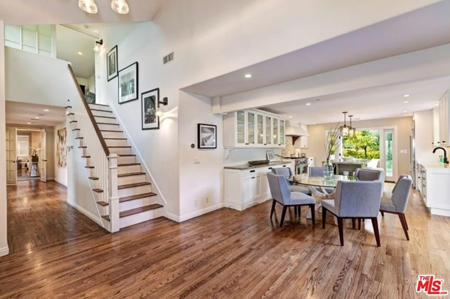 The house has an open floor plan, solid oak floors, French doors and 180-degree ocean views.