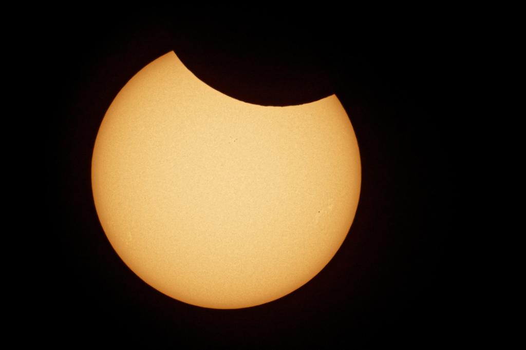 The Moon covers the sun during a partial solar eclipse in Cologne, Germany on June 10, 2021.