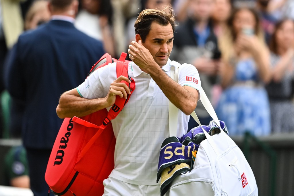 Roger Federer leaves a tennis match