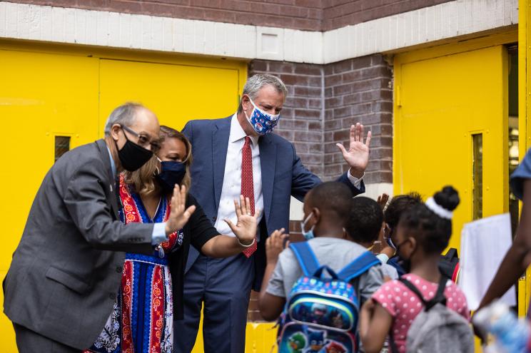 Mayor Bill de Blasio and NYC DOE chancellor Meisha Porter greet students at PS 6 in Brooklyn.