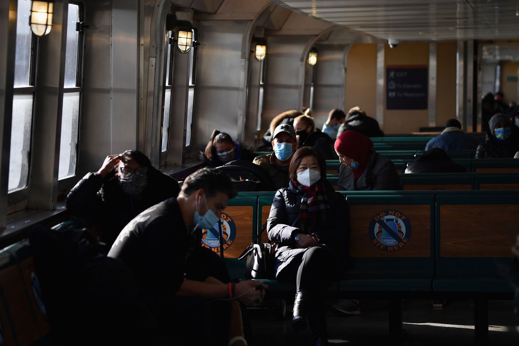 People commute to Manhattan on Staten Island Ferry amid the coronavirus pandemic on January 04, 2021.