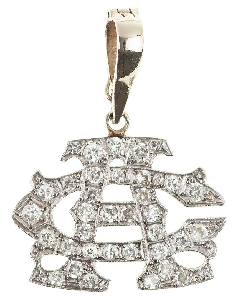 Al Capone's personalized 14K diamond pendant.