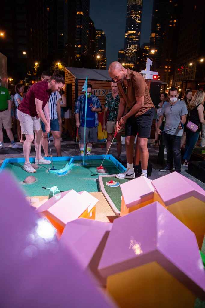 This mini golf course is filled with Pixar movie references, including the balloon house from "Up" and a cheese plate from "Ratatouille".