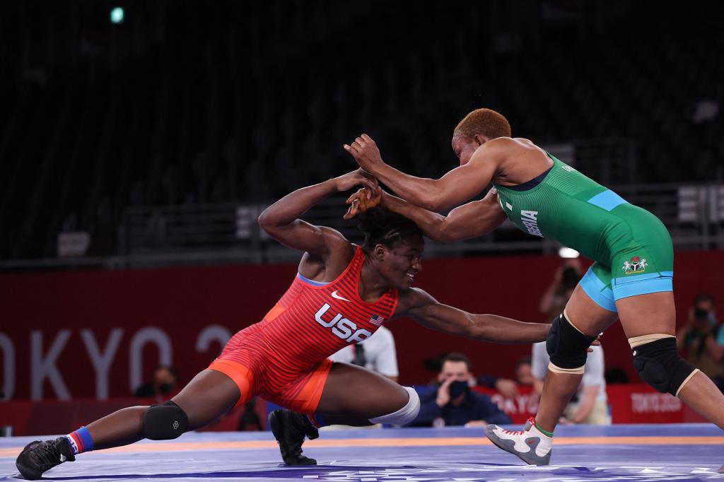 USA's Tamyra Mariama Mensah-Stock (red) wrestles Nigeria's Blessing Oborududu in their women's freestyle 68kg wrestling final match during the Tokyo 2020 Olympic Games.