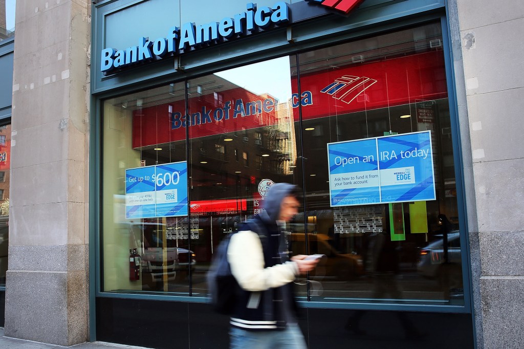 A person walks past a Bank of America branch in New York City