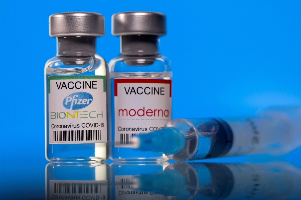 Vials with Pfizer-BioNTech and Moderna coronavirus disease (COVID-19) vaccine labels are seen in this illustration picture taken March 19, 2021