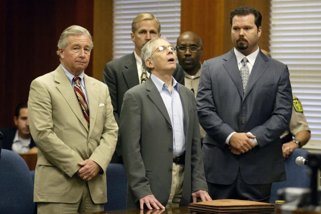 Robert Durst (center) after receiving a "Not Guilty" while on trial for dismembering Morris Black.