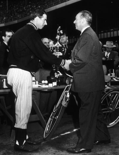 New York Yankee Joe DiMaggio shakes hands with New York City Mayor William O'Dwyer in a pre-game ceremony at Yankee Stadium.