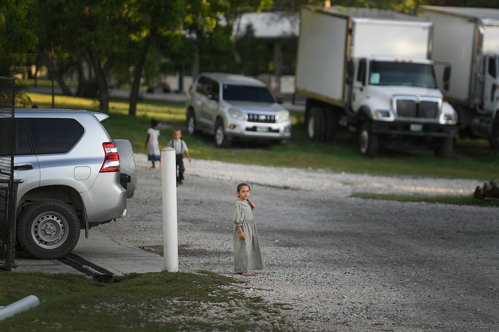 A child stands on the grounds of the Christian Aid Ministries headquarters.