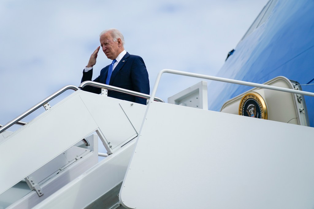 President Joe Biden returns a salute as he boards Air Force One for a trip to Connecticut to promote his "Build Back Better" agenda, Friday, Oct. 15, 2021