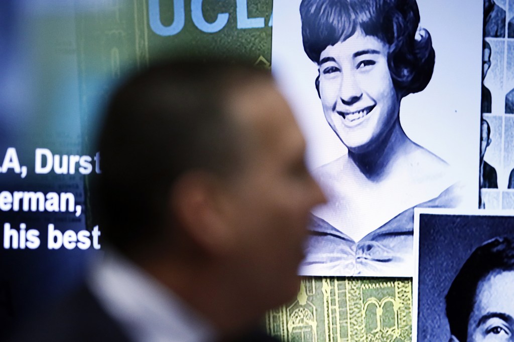 Deputy District Attorney John Lewin (L) makes his opening statements in front of a screen showing a picture of Susan Berman (C) during the Robert Durst Trial at the Airport courthouse in Los Angeles, California.