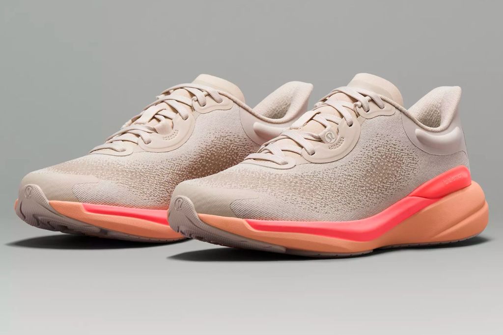 Light pink and hot pink colored workout shoes with thick sole.