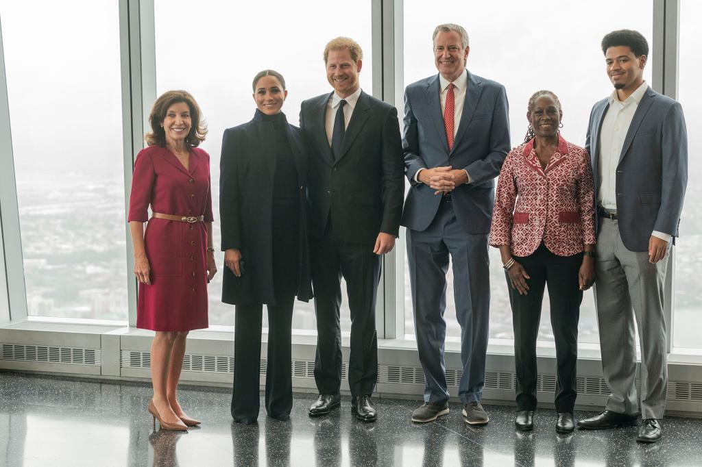 Bill de Blasio, his wife Chirlane McCray and son Dante are pictured with Prince Harry, Meghan Markle Gov. Kathy Hochul on the 102nd floor of the World Trade Center.