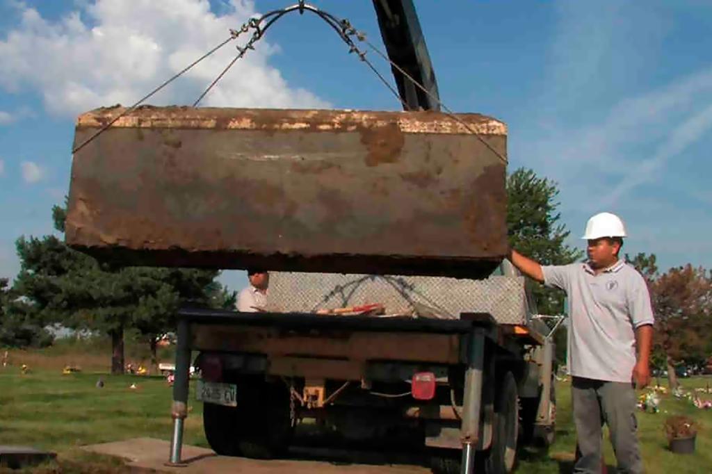 authorities exhume a box with the remains of unidentified victims of serial killer John Wayne Gacy