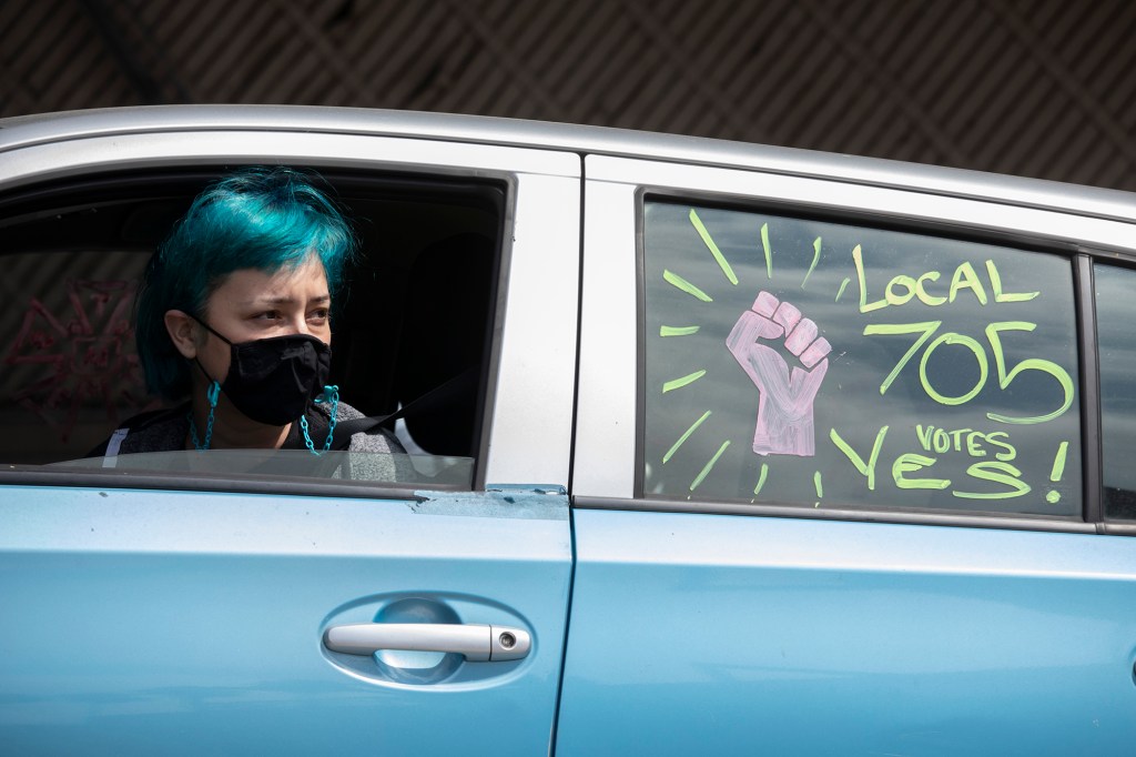 Pro-labor slogans on a car.